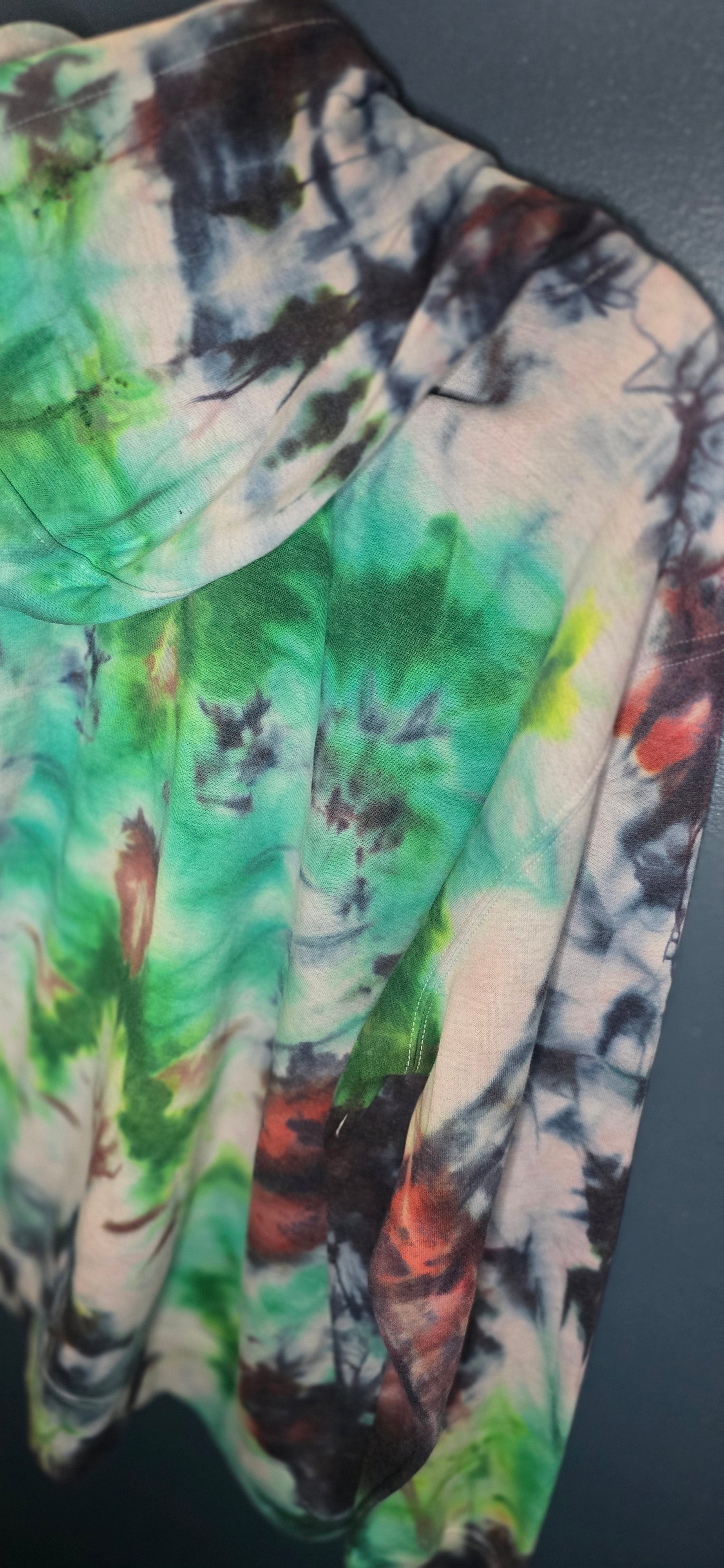 Colorful tie-dye pattern on a dark background