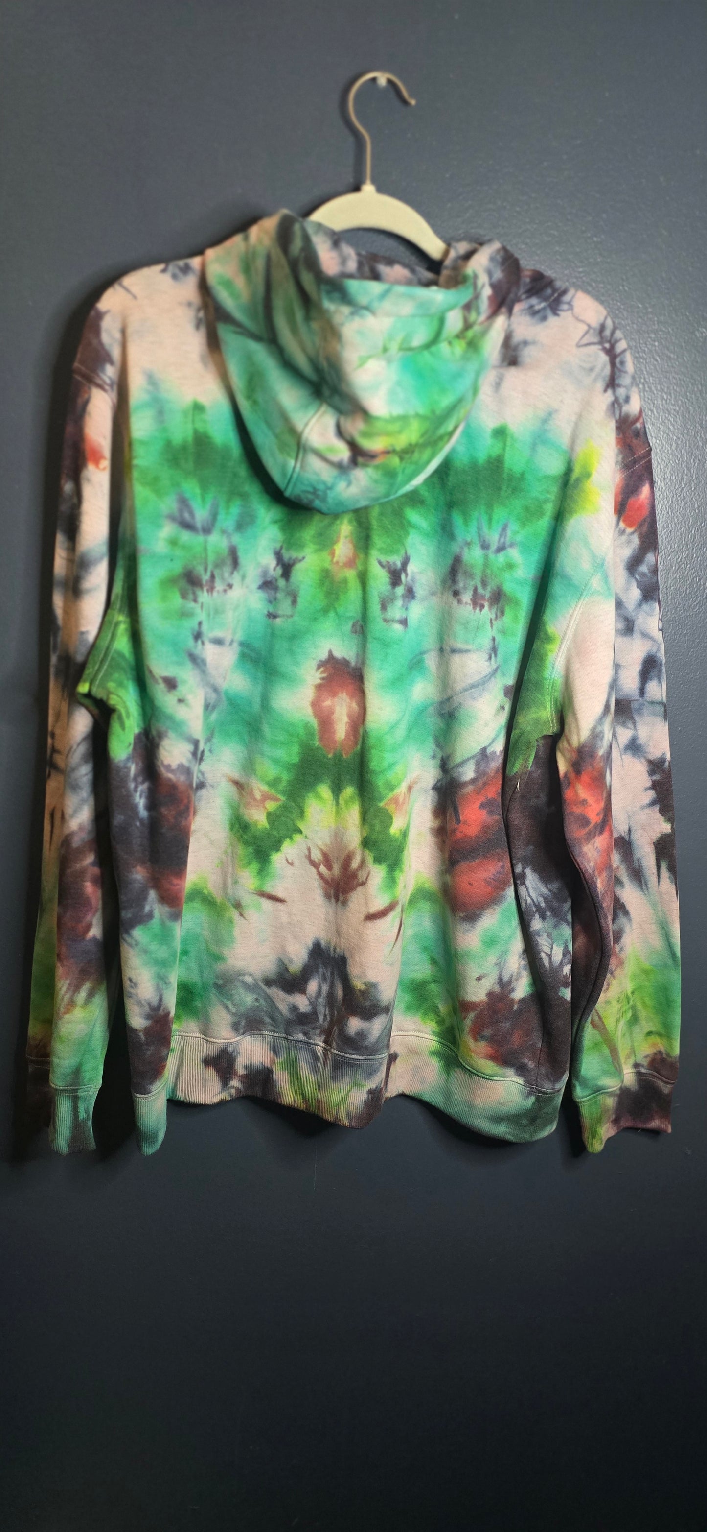 Colorful tie-dye patterned garment on a dark background