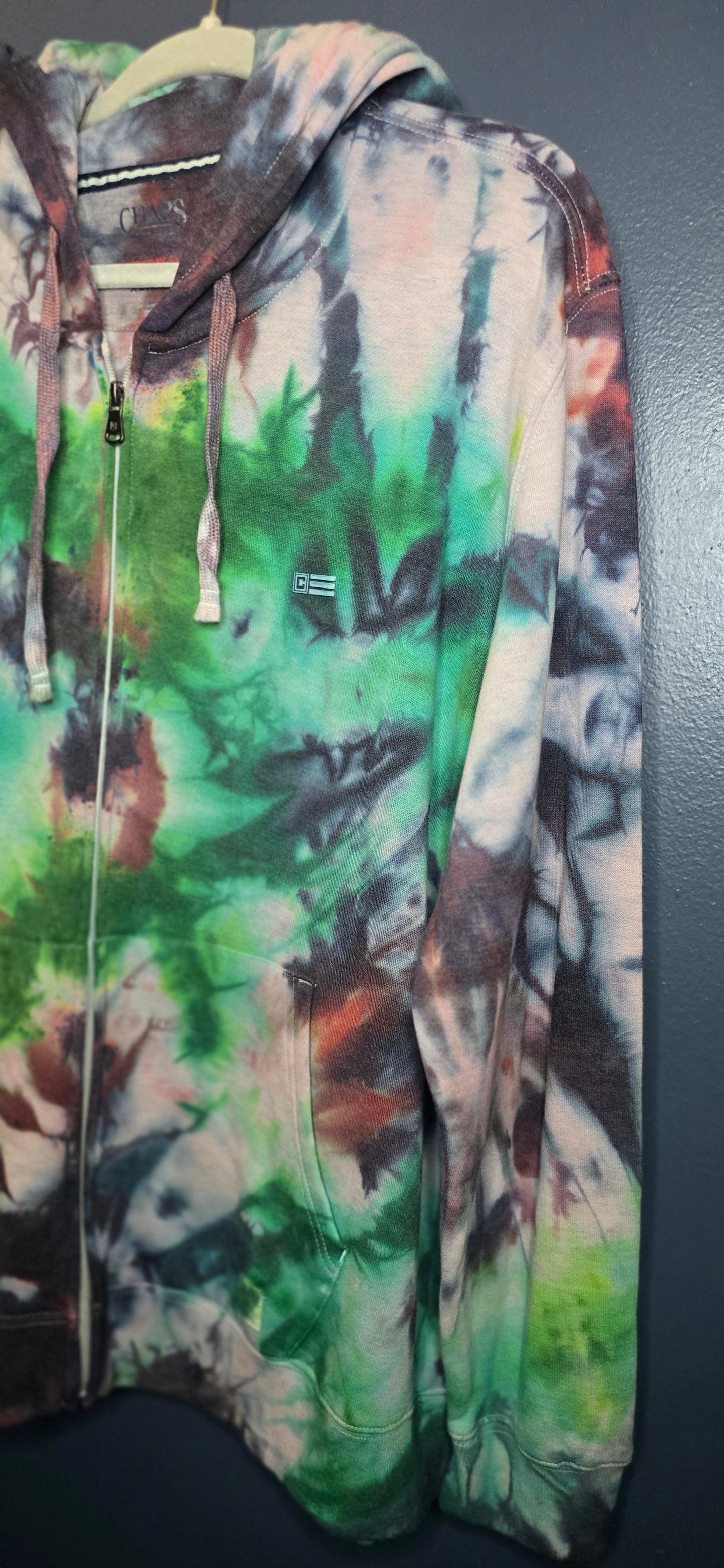 Multicolored camouflage jacket on a dark background