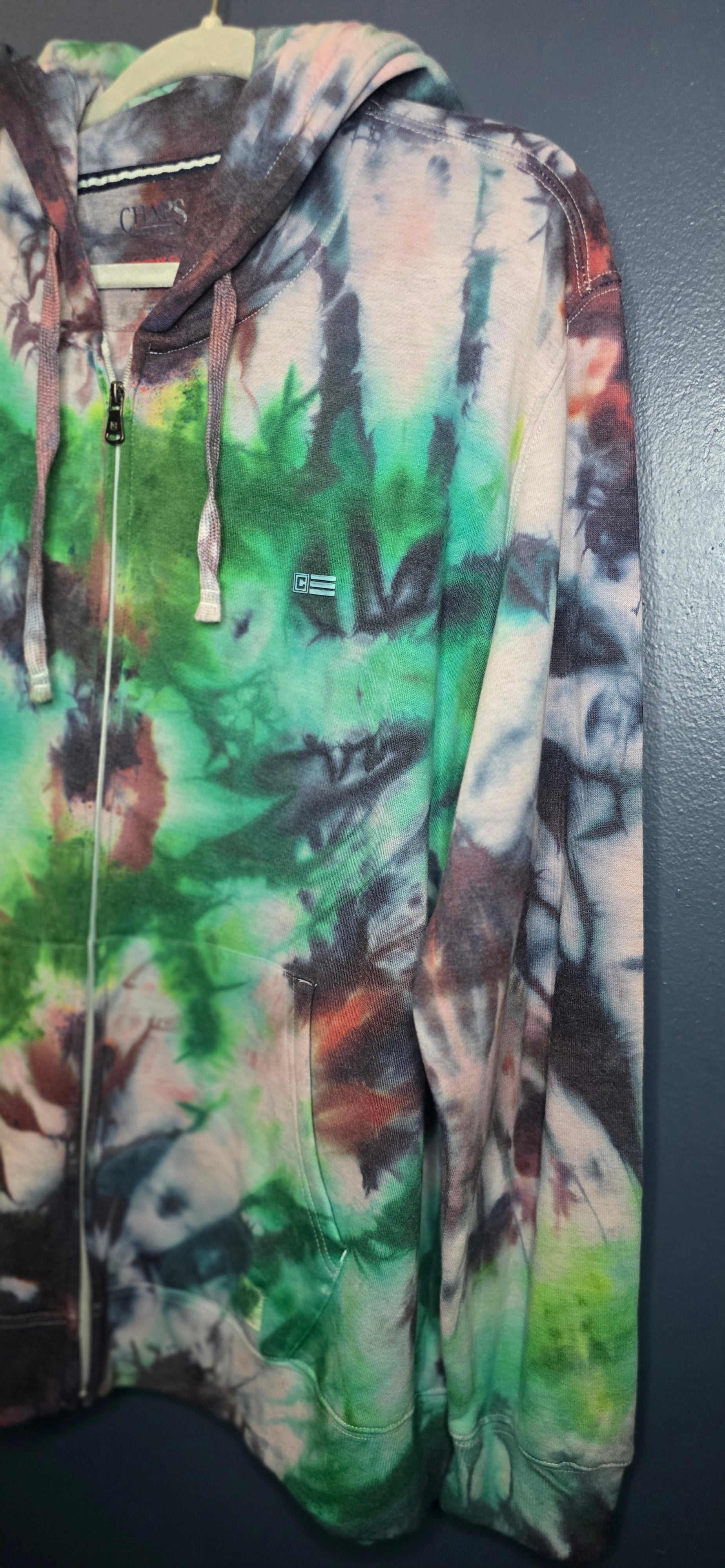 Multicolored camouflage jacket on a dark background